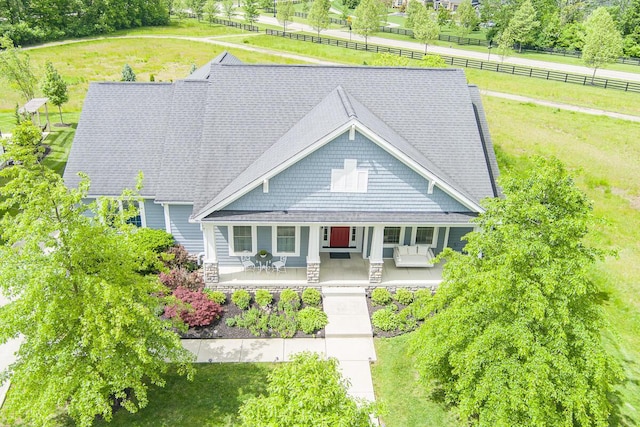 10641 Arrowwood Dr, Plain City, OH 43064 - view of front facade with a porch, stone siding, and roof with shingles