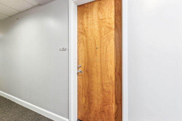 106 N High St Unit 303, Columbus, OH 43215 - hallway with carpet floors, baseboards, and a drop ceiling