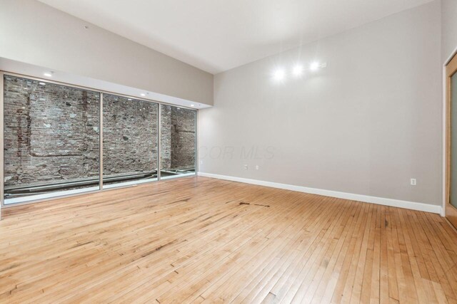106 N High St Unit 303, Columbus, OH 43215 - unfurnished room with hardwood / wood-style floors and baseboards