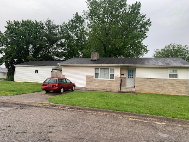 101 Gale Ct, Circleville, OH 43113 - single story home with a chimney, a front yard, entry steps, and stone siding