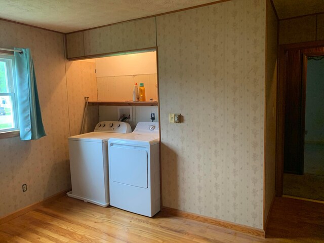 101 Gale Ct, Circleville, OH 43113 - laundry room featuring separate washer and dryer, light wood-style flooring, and crown molding