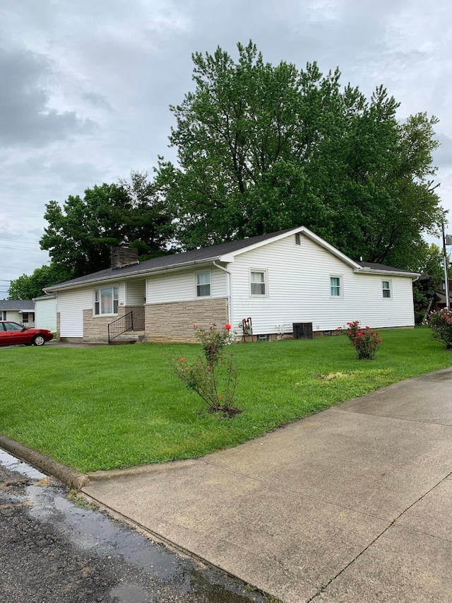 101 Gale Ct, Circleville, OH 43113 - view of property exterior featuring a yard, a chimney, and cooling unit