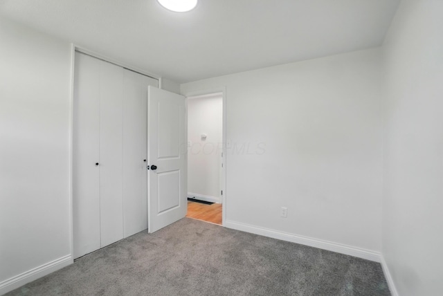 1410 E Dublin Granville Rd, Columbus, OH 43229 - unfurnished bedroom with carpet flooring, a closet, and baseboards