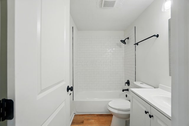 1410 E Dublin Granville Rd, Columbus, OH 43229 - full bathroom featuring wood finished floors, toilet, vanity, and washtub / shower combination