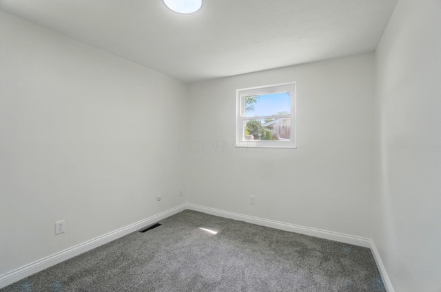 1410 E Dublin Granville Rd, Columbus, OH 43229 - unfurnished room with dark colored carpet and baseboards