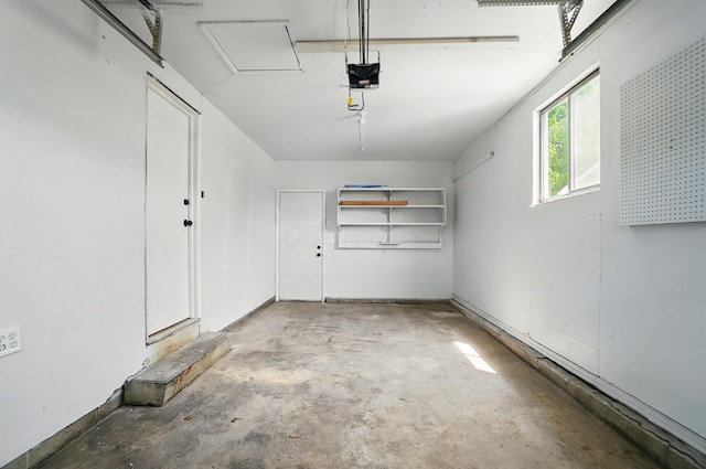 1410 E Dublin Granville Rd, Columbus, OH 43229 - garage featuring a garage door opener and baseboards