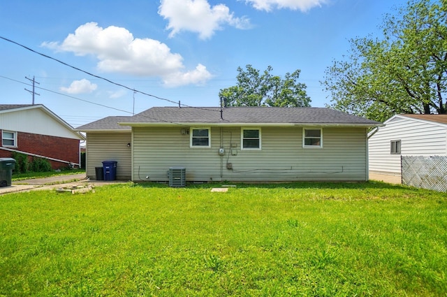 1410 E Dublin Granville Rd, Columbus, OH 43229 - rear view of property featuring a lawn and central air condition unit
