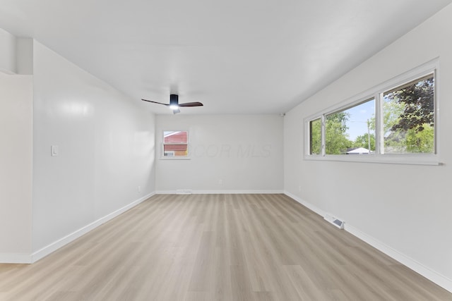 1116 S Yearling Rd, Columbus, OH 43227 - spare room with light wood-style floors, a ceiling fan, and healthy amount of natural light