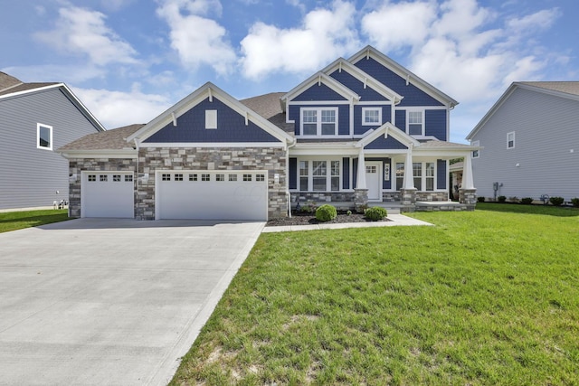 7578 Hastings St, Pickerington, OH 43147 - craftsman-style home featuring a garage, a porch, driveway, a front lawn, and stone siding