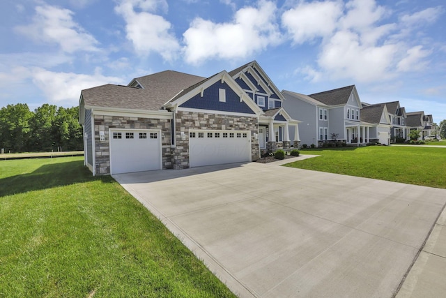 7578 Hastings St, Pickerington, OH 43147 - view of front facade featuring a front lawn, an attached garage, concrete driveway, and stone siding
