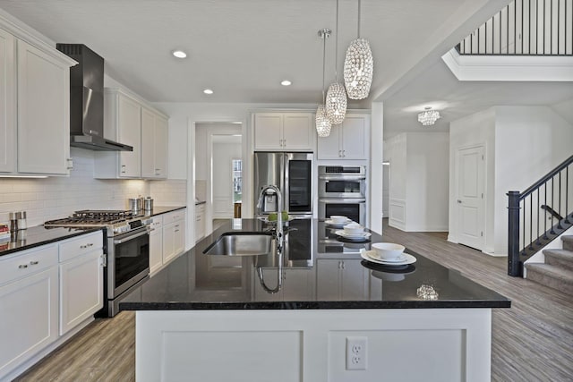 7578 Hastings St, Pickerington, OH 43147 - kitchen featuring appliances with stainless steel finishes, wall chimney exhaust hood, a sink, backsplash, and recessed lighting