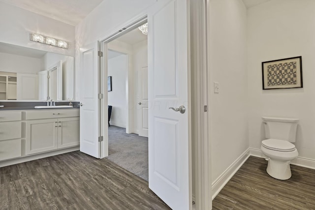 7578 Hastings St, Pickerington, OH 43147 - bathroom with wood finished floors, baseboards, vanity, and toilet