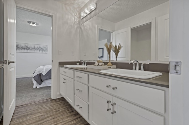 7578 Hastings St, Pickerington, OH 43147 - ensuite bathroom featuring wood finished floors and double vanity