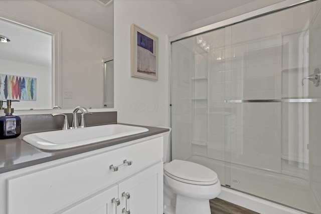 7578 Hastings St, Pickerington, OH 43147 - full bathroom featuring a shower stall, vanity, toilet, and wood finished floors