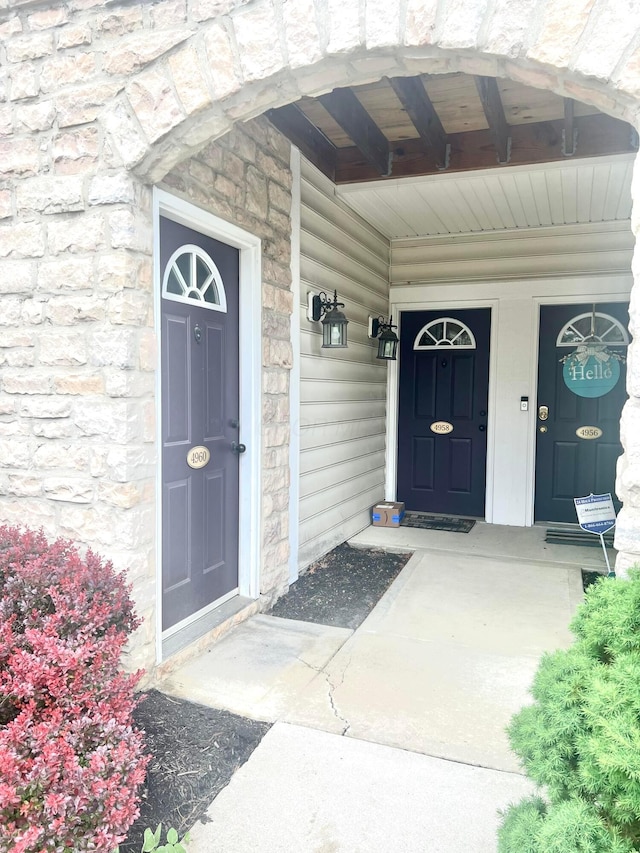 4960 Ivyvine Blvd, Dublin, OH 43016 - view of exterior entry with stone siding and a porch