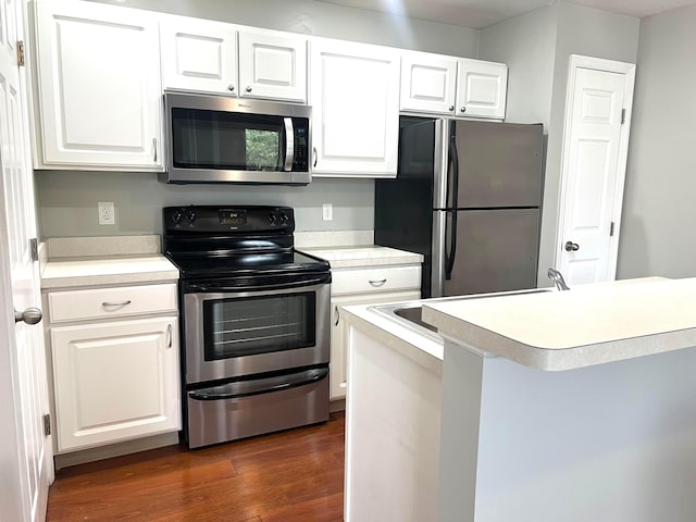 4960 Ivyvine Blvd, Dublin, OH 43016 - kitchen with stainless steel appliances, light countertops, dark wood finished floors, and white cabinets