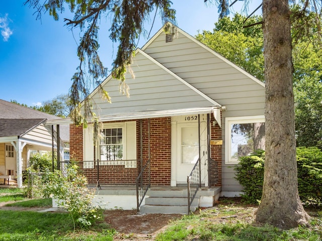 1052 Geers Ave, Columbus, OH 43206 - bungalow-style house featuring brick siding and a porch