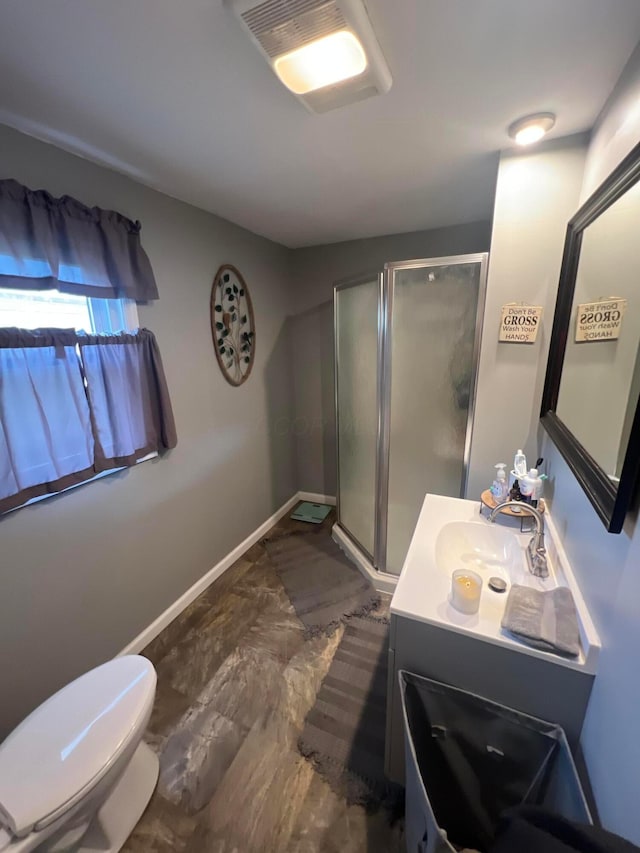 1119 Poplar St, Nelsonville, OH 45764 - bathroom featuring a stall shower, vanity, toilet, and baseboards