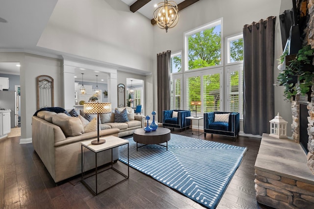 3624 Sparrow Ct, Hilliard, OH 43026 - living area featuring a chandelier, a towering ceiling, dark wood-style flooring, baseboards, and beamed ceiling