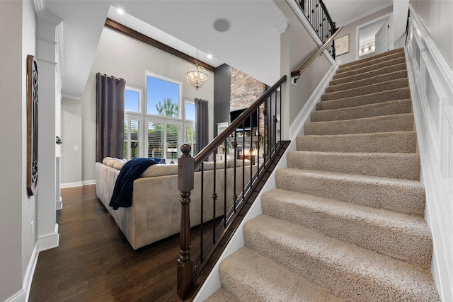 3624 Sparrow Ct, Hilliard, OH 43026 - stairs with a chandelier, wood finished floors, a high ceiling, baseboards, and recessed lighting