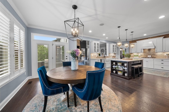 3624 Sparrow Ct, Hilliard, OH 43026 - dining space featuring a chandelier, dark wood-style floors, recessed lighting, baseboards, and ornamental molding