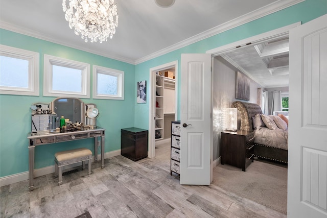 3624 Sparrow Ct, Hilliard, OH 43026 - bedroom featuring crown molding, wood finished floors, a spacious closet, baseboards, and a chandelier
