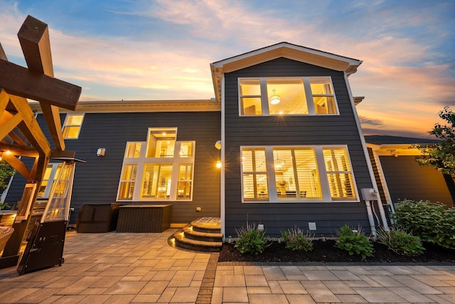 3624 Sparrow Ct, Hilliard, OH 43026 - back of house at dusk with a patio