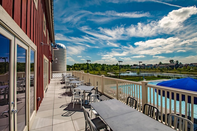 10319 Fox Hill Ct, Plain City, OH 43064 - view of patio with a water view and outdoor dining area
