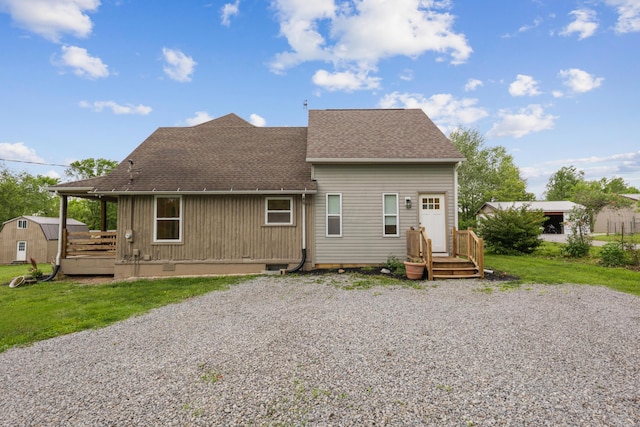7700 State Route 61, Sunbury, OH 43074 - rear view of house featuring a shingled roof and a lawn