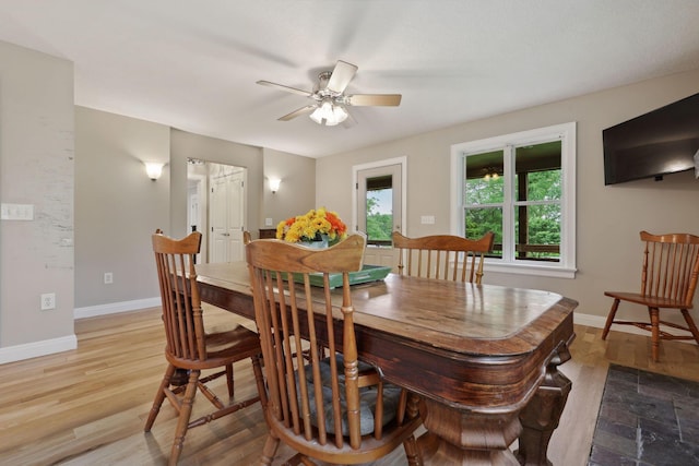 7700 State Route 61, Sunbury, OH 43074 - dining room with a ceiling fan, baseboards, and wood finished floors