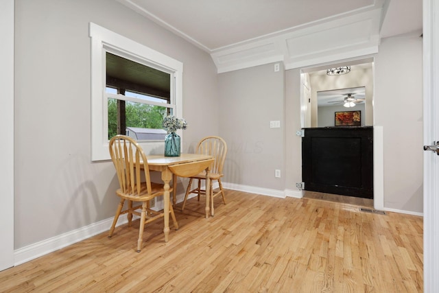 7700 State Route 61, Sunbury, OH 43074 - dining area featuring wood finished floors, baseboards, ornamental molding, and ceiling fan