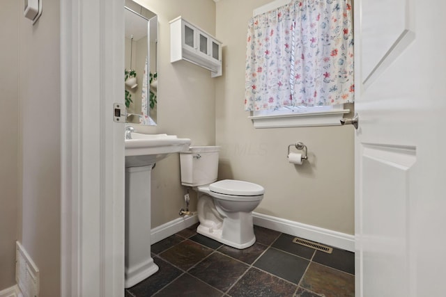 7700 State Route 61, Sunbury, OH 43074 - bathroom featuring baseboards and toilet