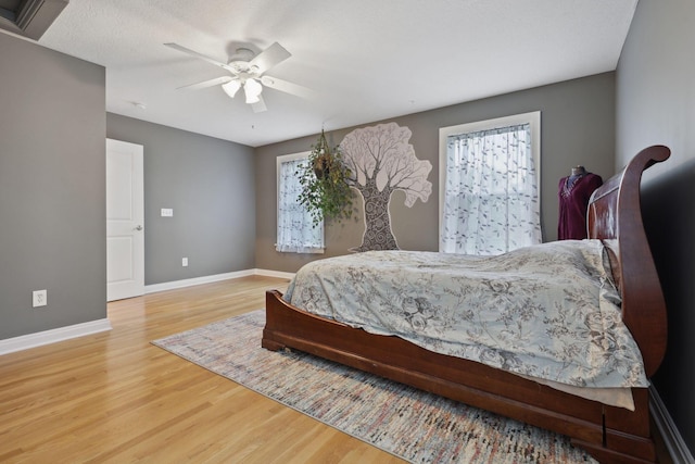7700 State Route 61, Sunbury, OH 43074 - bedroom featuring wood finished floors, baseboards, and a ceiling fan