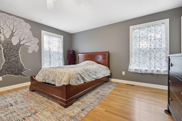 7700 State Route 61, Sunbury, OH 43074 - bedroom featuring wood finished floors, baseboards, and ceiling fan