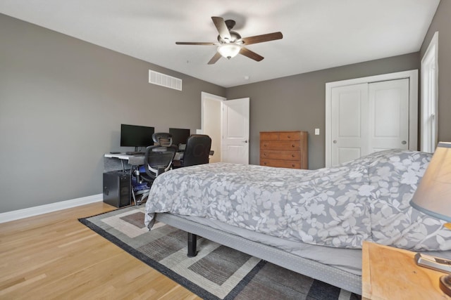 7700 State Route 61, Sunbury, OH 43074 - bedroom with wood finished floors, baseboards, a closet, a ceiling fan, and an office area
