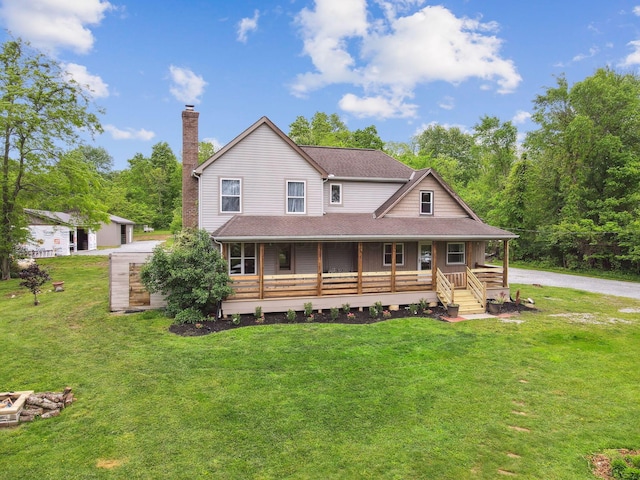 7700 State Route 61, Sunbury, OH 43074 - farmhouse-style home with a chimney, a porch, and a front yard