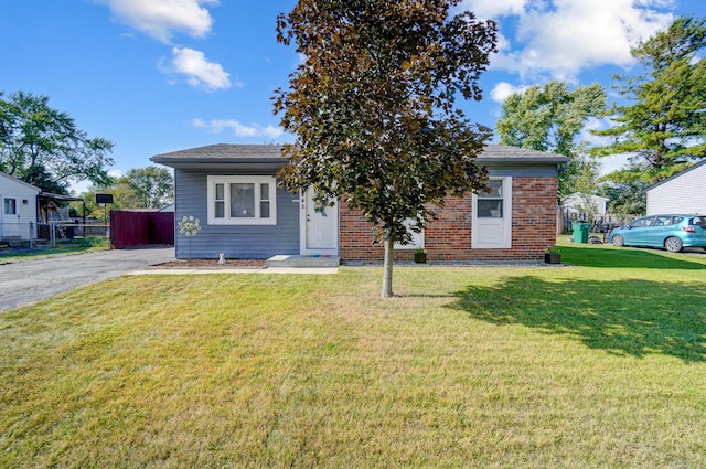 8448 Blue Lake Ave, Galloway, OH 43119 - view of front of house with brick siding and asphalt driveway