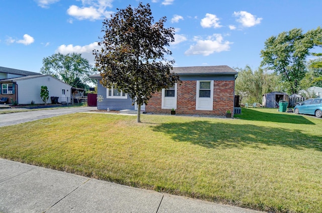 8448 Blue Lake Ave, Galloway, OH 43119 - view of front of property featuring brick siding and a front lawn