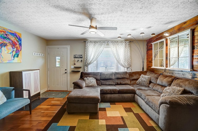 8448 Blue Lake Ave, Galloway, OH 43119 - living area with wood finished floors, ceiling fan, and a textured ceiling