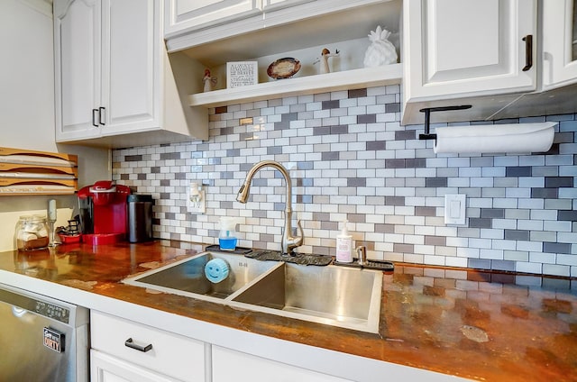 8448 Blue Lake Ave, Galloway, OH 43119 - kitchen with a sink, stainless steel dishwasher, dark countertops, and tasteful backsplash