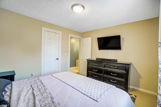 8448 Blue Lake Ave, Galloway, OH 43119 - carpeted bedroom featuring baseboards and a textured ceiling