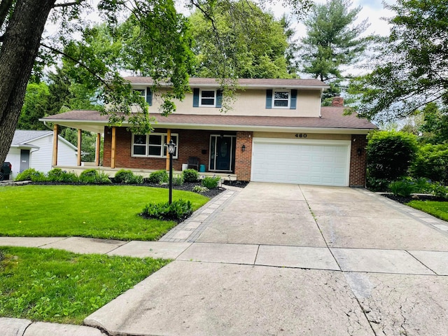 460 Blandings Ct, Worthington, OH 43085 - traditional-style home featuring driveway, a front lawn, brick siding, and a garage