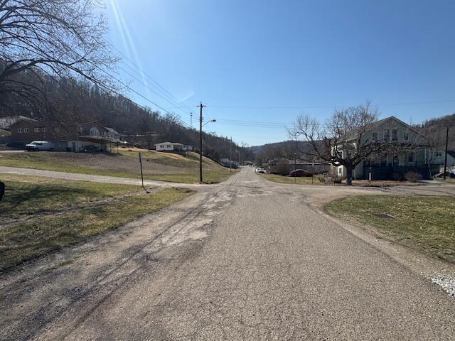 68511 Liston Ave, Bridgeport, OH 43912 - view of asphalt road featuring street lighting