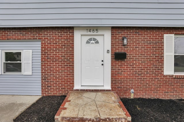 1465 Zenner Dr, Columbus, OH 43207 - view of exterior entry featuring brick siding