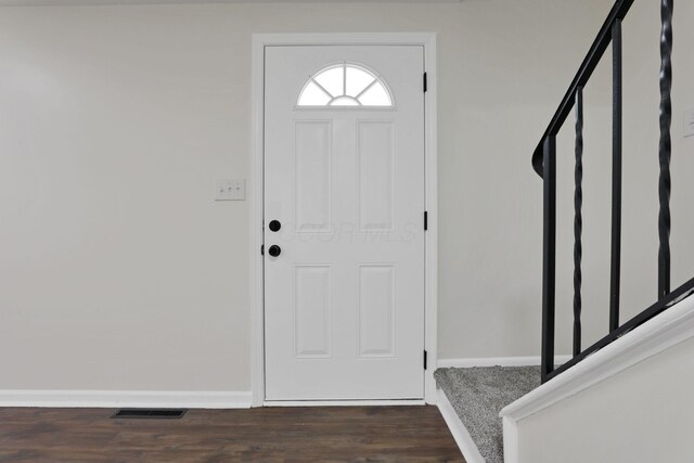 1465 Zenner Dr, Columbus, OH 43207 - foyer entrance featuring baseboards and dark wood-style flooring