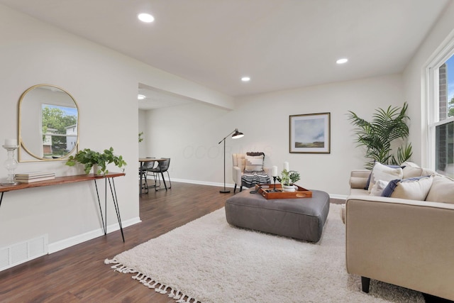1465 Zenner Dr, Columbus, OH 43207 - living room with wood finished floors, recessed lighting, plenty of natural light, and baseboards