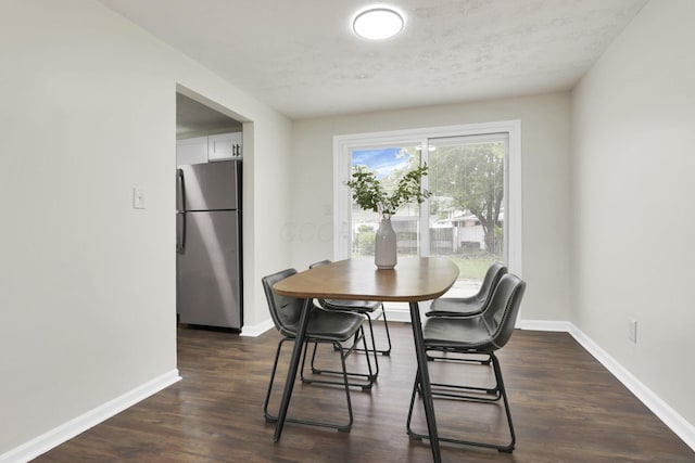1465 Zenner Dr, Columbus, OH 43207 - dining area featuring baseboards and dark wood finished floors