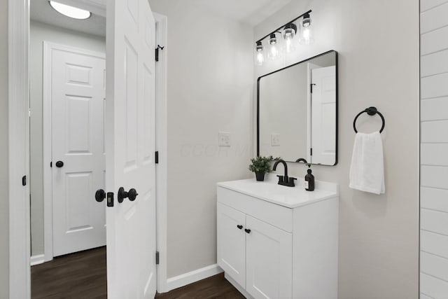 1465 Zenner Dr, Columbus, OH 43207 - bathroom featuring vanity, wood finished floors, and baseboards