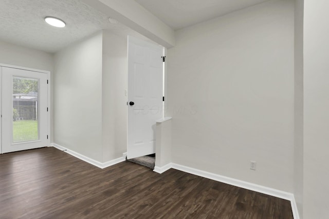 1465 Zenner Dr, Columbus, OH 43207 - unfurnished room featuring baseboards and dark wood-style floors
