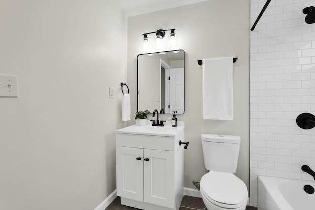 1465 Zenner Dr, Columbus, OH 43207 - full bathroom with vanity, toilet, bathtub / shower combination, and baseboards